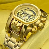 Gold Invicta wrist watch