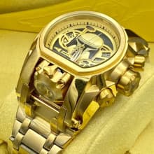 Gold Invicta wrist watch