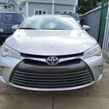 Silver Toyota Camry [ Accident free ] .